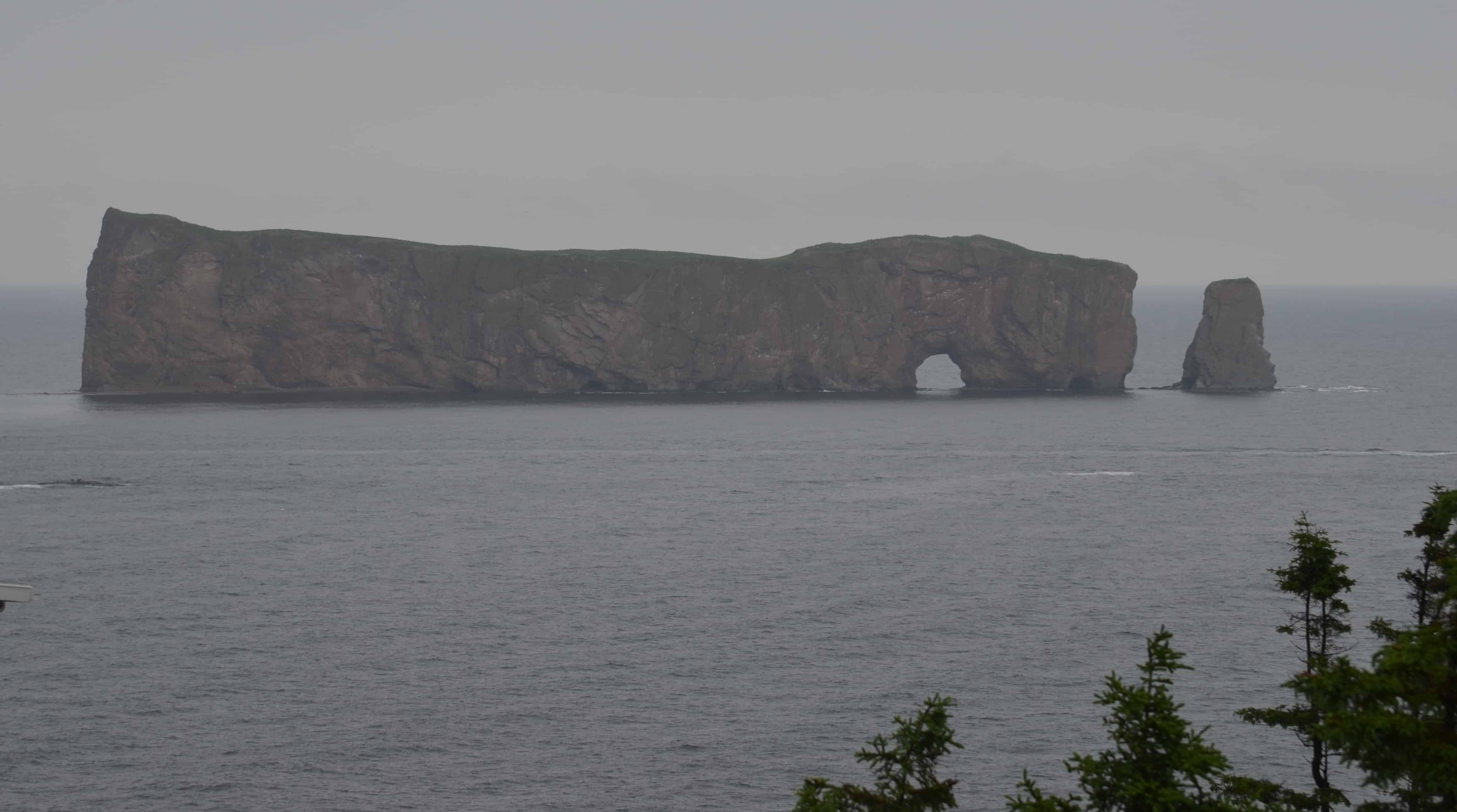 Percé Rock standing out of the Gulf of Saint Lawrence, the iconic natural arch of the Gaspé Peninsula