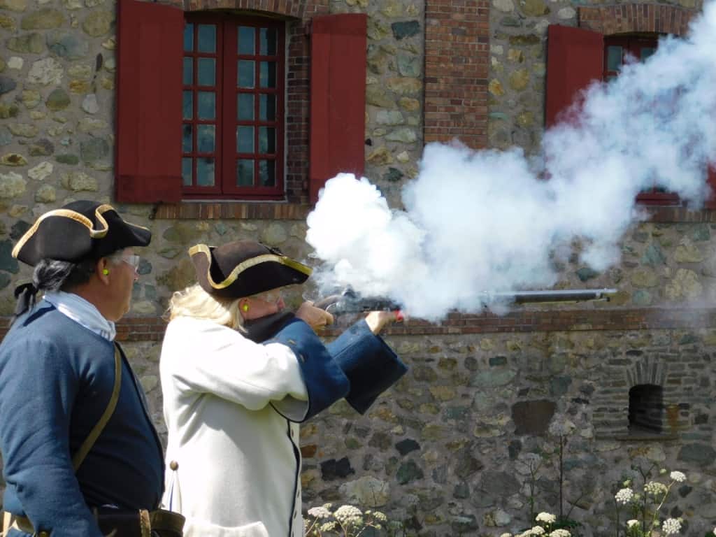 Janice firing a musket at the Fortress of Louisbourg